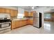Traditional kitchen with stainless steel refrigerator, light countertops, and mosaic backsplash at 963 27Th S Ave, St Petersburg, FL 33705