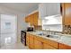 Traditional kitchen showcasing light countertops, mosaic backsplash, and stainless steel appliances at 963 27Th S Ave, St Petersburg, FL 33705