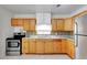 Traditional kitchen with light countertops, mosaic backsplash, and modern stainless steel appliances at 963 27Th S Ave, St Petersburg, FL 33705