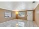 Spacious living room with tile flooring, two large windows, and an inviting atmosphere at 963 27Th S Ave, St Petersburg, FL 33705