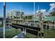 Well-maintained boat lift on a sunny day near waterfront condominiums at 1 Seaside Ln # 302, Belleair, FL 33756