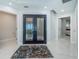 Bright entryway features a decorative glass double door and glossy marble floors, welcoming visitors at 1 Seaside Ln # 302, Belleair, FL 33756