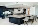 Modern kitchen with a large island, stainless steel appliances, and custom cabinetry at 1 Seaside Ln # 302, Belleair, FL 33756