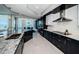 Elegant kitchen with stainless steel appliances, granite countertops, and ample cabinet space at 1 Seaside Ln # 302, Belleair, FL 33756