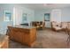 Bright living room with tile floors, lots of windows, seating area, and eating area at 1 Seaside Ln # 302, Belleair, FL 33756