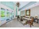 A spacious lobby entrance features soaring ceilings, elegant decor, and access to the outside at 1 Seaside Ln # 302, Belleair, FL 33756