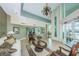 Well-decorated lobby with a high ceiling, a gorgeous chandelier and access to the outdoors at 1 Seaside Ln # 302, Belleair, FL 33756