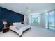 Serene main bedroom with a comfy bed, ocean views, and access to a private balcony at 1 Seaside Ln # 302, Belleair, FL 33756