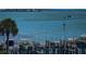 Scenic waterfront view of a marina with boats docked and coastal homes in the background at 1 Seaside Ln # 302, Belleair, FL 33756