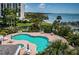 Inviting community pool with comfortable seating overlooking the waterfront view at 1 Seaside Ln # 302, Belleair, FL 33756