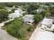 Aerial view of property with mature trees and close to neighboring houses at 10703 59Th Ave, Seminole, FL 33772