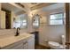 A lovely bathroom with a modern sink, updated fixtures, and vanity mirror with lighting at 10703 59Th Ave, Seminole, FL 33772