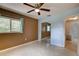 This cozy bedroom features natural light, two-tone walls, a ceiling fan, and a mirrored closet at 10703 59Th Ave, Seminole, FL 33772