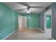 The room has dual toned walls, ceiling fan and doorways to other rooms at 10703 59Th Ave, Seminole, FL 33772