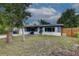 Cozy single-story home with a well-kept front lawn and a classic garage at 10703 59Th Ave, Seminole, FL 33772
