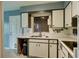 Functional kitchen with ample counter space, modern appliances, and stylish cabinetry at 10703 59Th Ave, Seminole, FL 33772