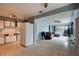Open-concept living room and kitchen area with tile flooring and ample natural light at 10703 59Th Ave, Seminole, FL 33772