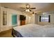 This spacious bedroom offers plenty of room to relax with a TV, natural light, and ceiling fans for your comfort at 10703 59Th Ave, Seminole, FL 33772