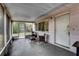 Cozy screened-in porch with furniture, with outdoor access at 10703 59Th Ave, Seminole, FL 33772