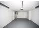Clean garage with water heater, storage space, and room for parking at 10740 Oldham Rd, Port Richey, FL 34668