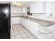 Bright kitchen offers ample storage with generous counter space and modern fixtures at 10740 Oldham Rd, Port Richey, FL 34668