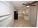 Functional kitchen with white cabinets, granite countertops, and modern appliances at 10740 Oldham Rd, Port Richey, FL 34668