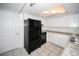 Bright kitchen features stainless steel appliances, granite countertops, and tile flooring at 10740 Oldham Rd, Port Richey, FL 34668