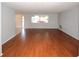 Inviting living room with large window, showcasing natural light and stylish flooring at 10740 Oldham Rd, Port Richey, FL 34668