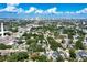 Aerial perspective of a neighborhood highlighting its lush greenery and close distance to the cityscape at 115 S Beverly Ave, Tampa, FL 33609