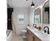 Beautiful bathroom with double vanity, stylish black and white tile, and modern fixtures at 115 S Beverly Ave, Tampa, FL 33609