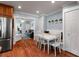 Cozy dining area features a white table, bench seating, and cottage-style design at 115 S Beverly Ave, Tampa, FL 33609