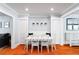 Bright dining room features a white table, beadboard, and easy access to adjacent rooms at 115 S Beverly Ave, Tampa, FL 33609