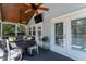 Comfortable screened lanai features wood ceiling with fans, a TV and comfortable seating area at 115 S Beverly Ave, Tampa, FL 33609