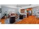 The living room features hardwood floors, and opens into a modern kitchen with stainless steel appliances at 115 S Beverly Ave, Tampa, FL 33609