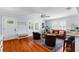 The living room features hardwood floors, lots of natural light from the window, and neutral paint at 115 S Beverly Ave, Tampa, FL 33609