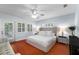 Inviting main bedroom with french doors, plush bedding, and a relaxing atmosphere at 115 S Beverly Ave, Tampa, FL 33609