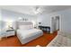 Bright main bedroom with a comfortable bed, side tables, and access to an ensuite at 115 S Beverly Ave, Tampa, FL 33609