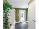 Mud room features a white storage cabinet with coat hooks and a white glass panel door at 115 S Beverly Ave, Tampa, FL 33609
