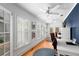 Bright home office with hardwood floors, natural light, and ample workspace at 115 S Beverly Ave, Tampa, FL 33609