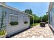 A charming patio features outdoor dining and room for garden boxes in a private setting at 115 S Beverly Ave, Tampa, FL 33609