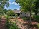 Lush backyard featuring beautiful landscaping and outdoor living space at 11530 Arlhuna Way, Dade City, FL 33525