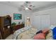 Bedroom with a ceiling fan, closet, and traditional-style furniture at 11530 Arlhuna Way, Dade City, FL 33525