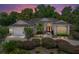 Charming single-story home with a landscaped front yard, curved walkway, double front doors and attached two-car garage at 11530 Arlhuna Way, Dade City, FL 33525