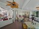 Multiple doorways and windows providing abundant natural light to sunroom and view of other rooms at 11530 Arlhuna Way, Dade City, FL 33525