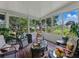 Beautiful four-season sunroom with lots of windows and cozy places to sit to enjoy the outside at 11530 Arlhuna Way, Dade City, FL 33525