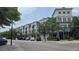 Desirable apartment exterior with modern architecture, balconies, and street-level shops and cafes nearby at 12219 Steppingstone Blvd, Tampa, FL 33635