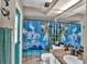 Bright bathroom features a beach-themed shower curtain and a granite countertop sink at 12219 Steppingstone Blvd, Tampa, FL 33635