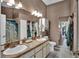 A spacious bathroom featuring a double sink and bright lighting at 12219 Steppingstone Blvd, Tampa, FL 33635