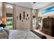 A brightly lit bedroom featuring an ocean view television and African-themed decor at 12219 Steppingstone Blvd, Tampa, FL 33635