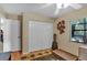 Bedroom featuring carpet, closet, decor, light fixture, and a window with natural light at 12219 Steppingstone Blvd, Tampa, FL 33635